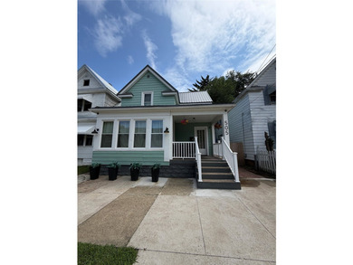 Welcome to this immaculately updated 4-bedroom, 2 full bathroom - photo 1