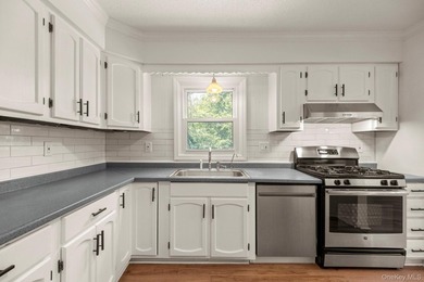 Tucked away on a beautifully wooded and private lot, this - photo 12