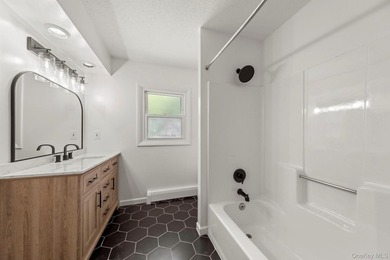 Tucked away on a beautifully wooded and private lot, this - photo 14