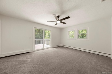 Tucked away on a beautifully wooded and private lot, this - photo 16
