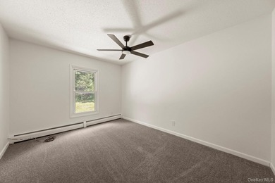 Tucked away on a beautifully wooded and private lot, this - photo 22