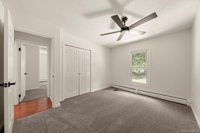 Tucked away on a beautifully wooded and private lot, this - photo 23