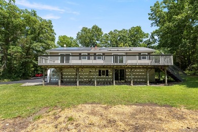 Tucked away on a beautifully wooded and private lot, this - photo 37