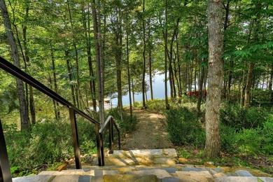 Nichee sur les rives paisibles du lac a l'Ile, cette residence - photo 14