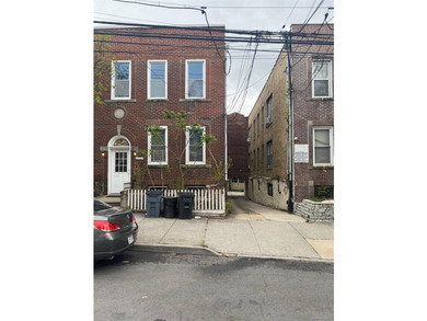 This sturdy and charming, solid brick five- to six-unit building - photo 1