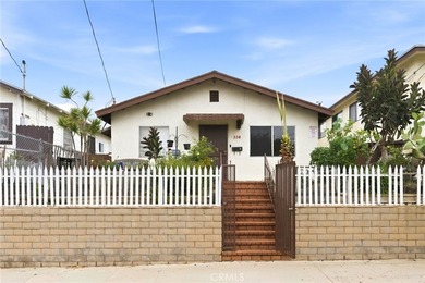 This well-cared for triplex is perched above the street and is - photo 2