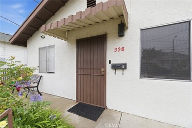 This well-cared for triplex is perched above the street and is - photo 5