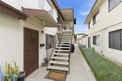 This well-cared for triplex is perched above the street and is - photo 6