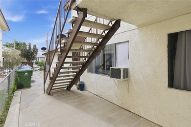 This well-cared for triplex is perched above the street and is - photo 7