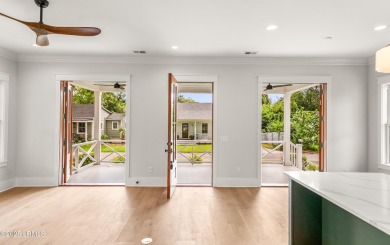 Experience historic Lowcountry elegance in this new 4-bed, 3