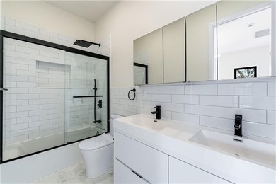 This fully renovated three-story, two-family brick townhouse in - photo 22