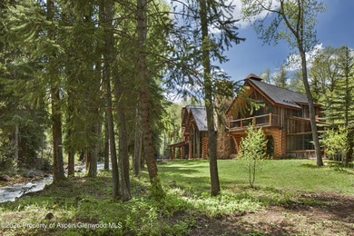 Set along the banks of picturesque Castle Creek, this remarkable - photo 1