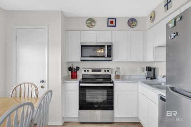 Beachside living made easy! This updated 2BR/1BA condo sits - photo 10