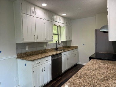 Welcome to this charming 3-bedroom, 2-bath home located just - photo 7
