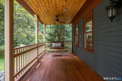 Set gracefully on a beautifully landscaped property framed by - photo 4