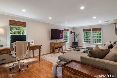 Set gracefully on a beautifully landscaped property framed by - photo 6