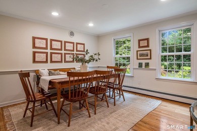 Set gracefully on a beautifully landscaped property framed by - photo 7