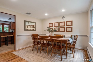 Set gracefully on a beautifully landscaped property framed by - photo 8