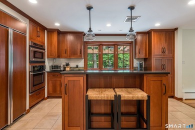 Set gracefully on a beautifully landscaped property framed by - photo 9