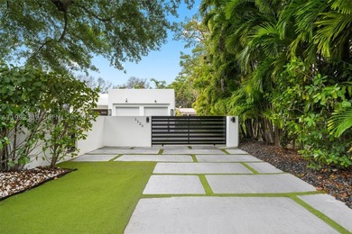 Fully gated and completely rebuilt in 2022, this modern home - photo 3