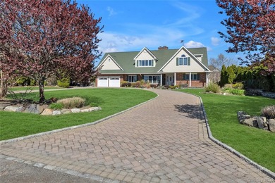 This spectacular expanded ranch sits on a deep waterfront lot - photo 1