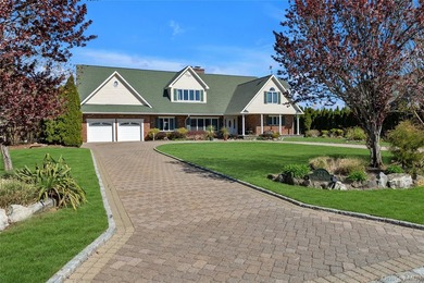 This spectacular expanded ranch sits on a deep waterfront lot - photo 3