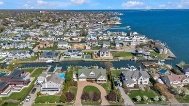 This spectacular expanded ranch sits on a deep waterfront lot - photo 4