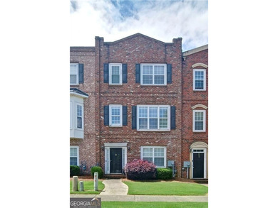 Welcome Home! This lovely 3-bedroom, 2.5 bath brick townhome - photo 2