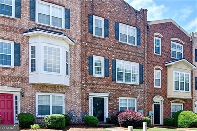 Welcome Home! This lovely 3-bedroom, 2.5 bath brick townhome - photo 3