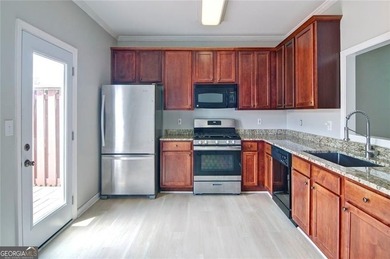 Welcome Home! This lovely 3-bedroom, 2.5 bath brick townhome - photo 9