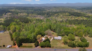 Unique and Charming English Cottage home on almost 13 acres in