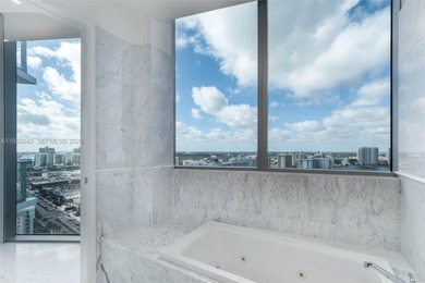 This exquisite 2 bed, 3-bath turnkey residence at the