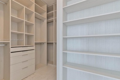 This exquisite 2 bed, 3-bath turnkey residence at the