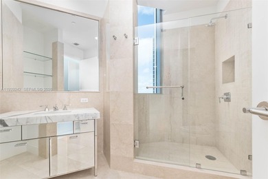 This exquisite 2 bed, 3-bath turnkey residence at the