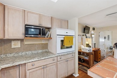 Welcome to this charming three-bedroom, two-bathroom home in - photo 8