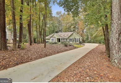 Nestled on a private cul-de-sac lot with beautiful wooded and - photo 2