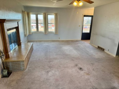 This 4-bedroom, 2-bathroom home, situated on a hilltop, offers