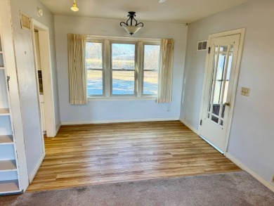 This 4-bedroom, 2-bathroom home, situated on a hilltop, offers