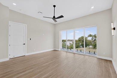 Experience modern waterfront luxury in this stunning - photo 14