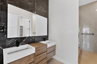 Experience modern waterfront luxury in this stunning - photo 16