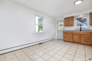 Excellent opportunity to own a well-maintained two-family home - photo 18