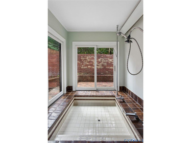 Hidden among mature trees on a rare double lot, this exceptional - photo 29