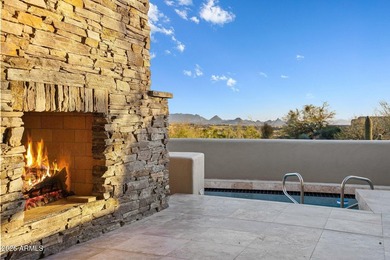 Framed by sweeping views of Pinnacle Peak and city lights, this
