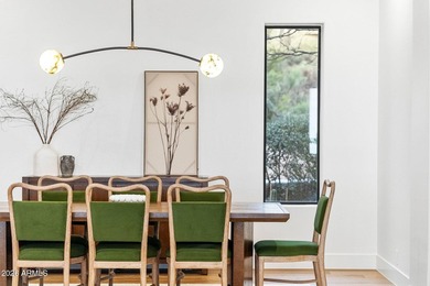 Framed by sweeping views of Pinnacle Peak and city lights, this