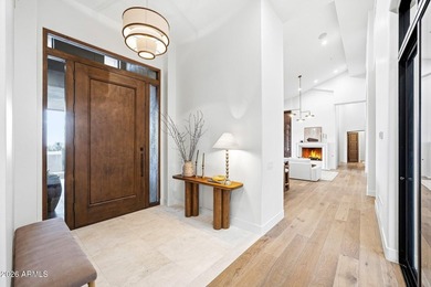 Framed by sweeping views of Pinnacle Peak and city lights, this