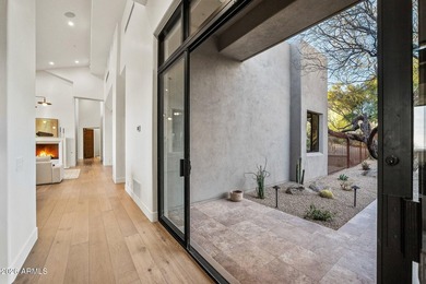 Framed by sweeping views of Pinnacle Peak and city lights, this