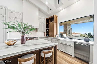 Framed by sweeping views of Pinnacle Peak and city lights, this