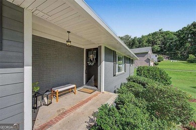 Step into this charming 4-bedroom, 2-bath brick beauty in Cobb - photo 3