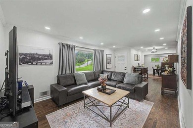 Step into this charming 4-bedroom, 2-bath brick beauty in Cobb - photo 4