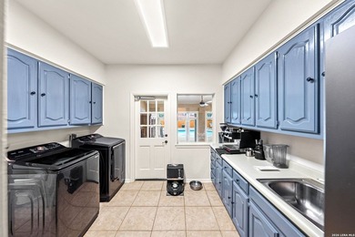 Set on a full acre in the exclusive gated community of Raintree - photo 28